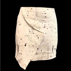 Mini pencil skirt. Asymmetrical. Black paint splatter design.